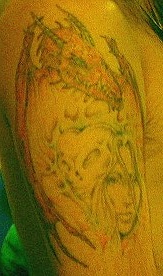 Tattoo left arm.